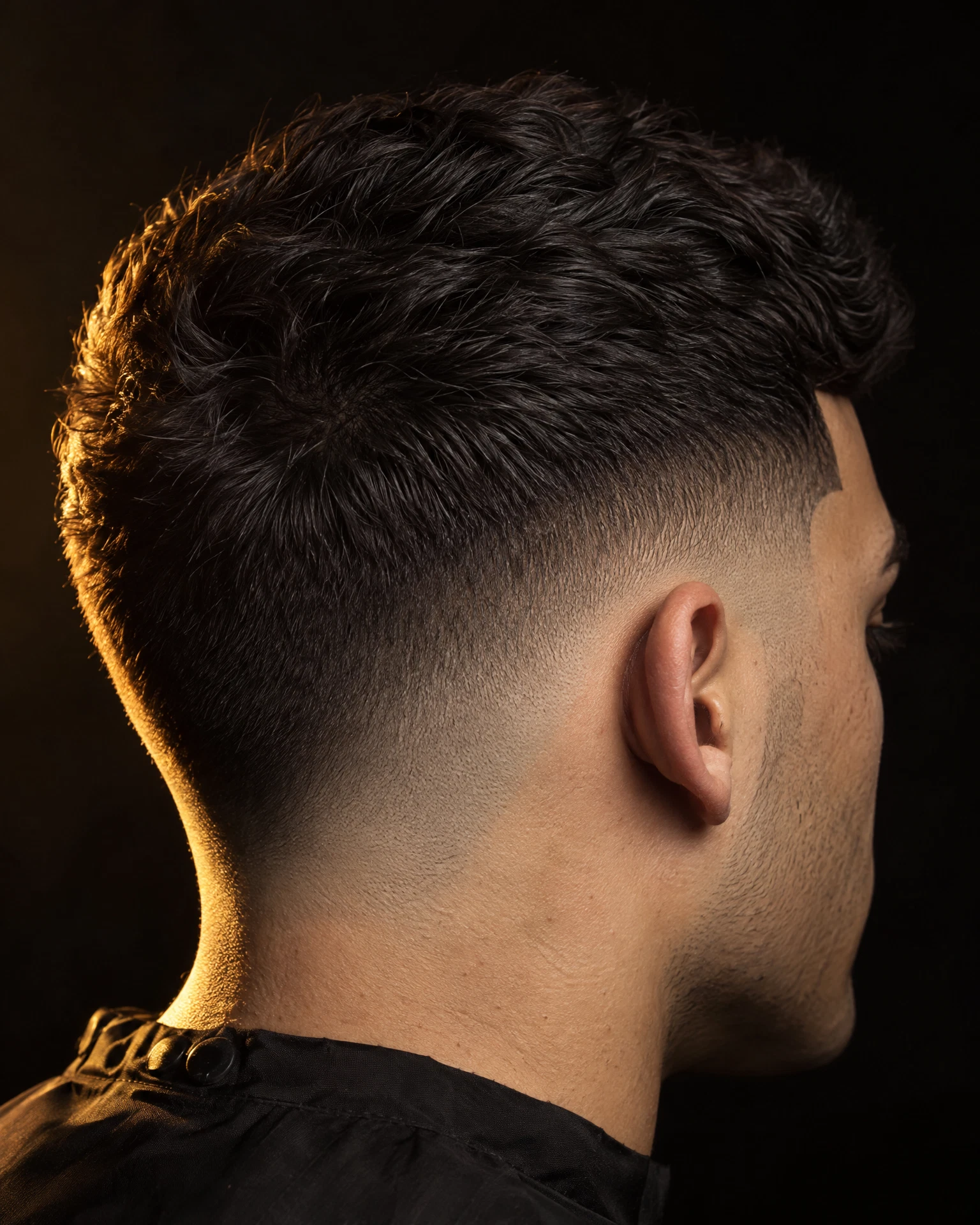 Adult low fade haircut with a crisp line-up
